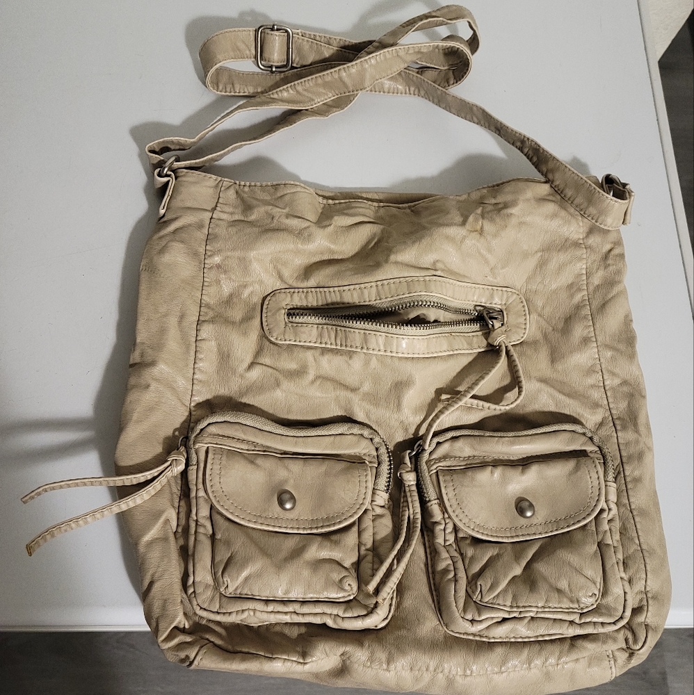 I'm selling a tan crossbody bag